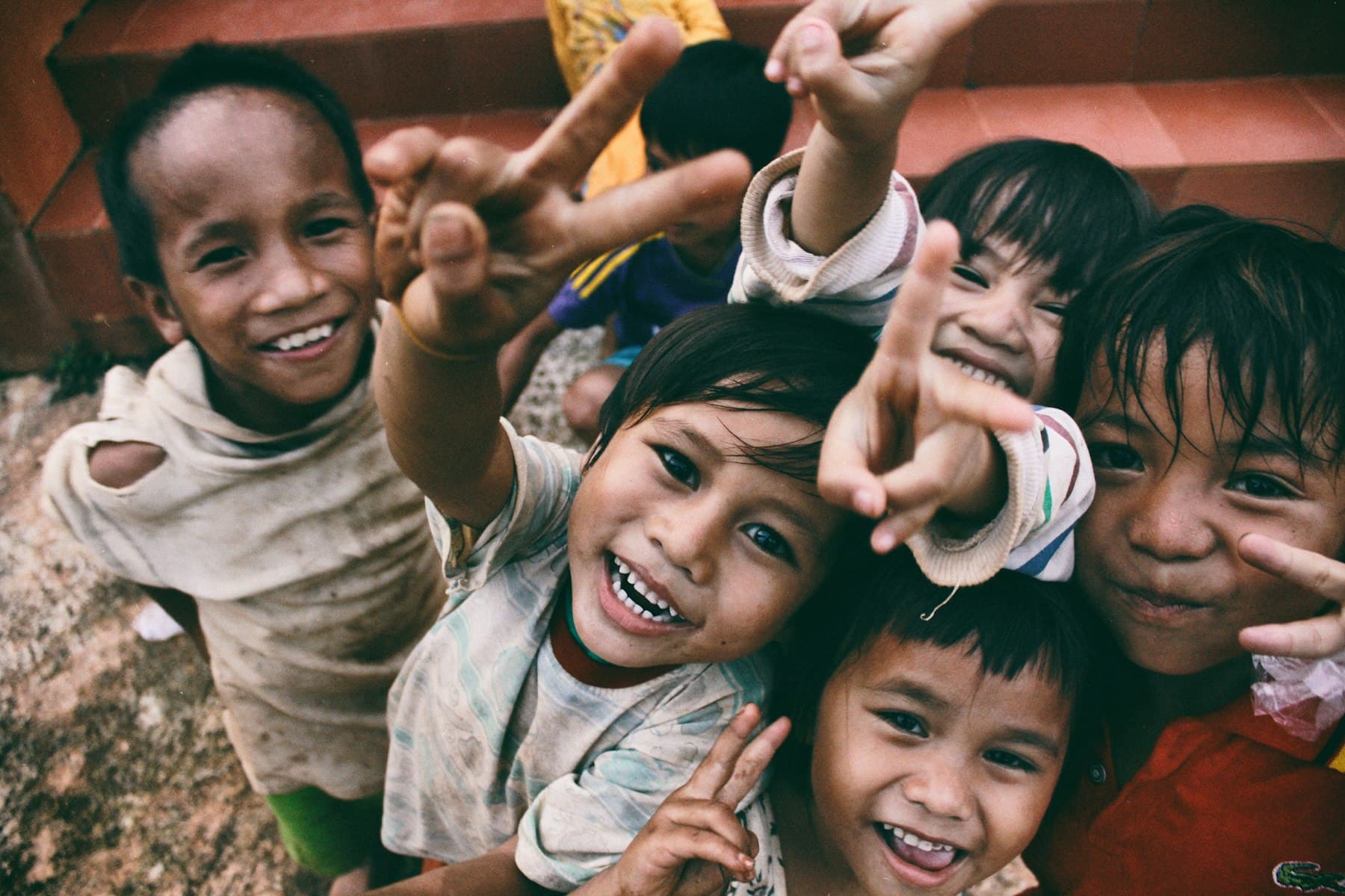 Children smiling at an NGO community programme